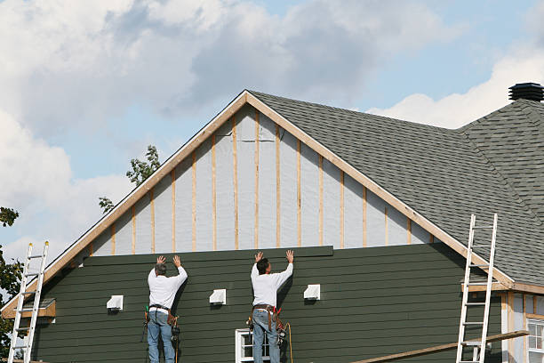 Professional Siding technician working in Chester, WV